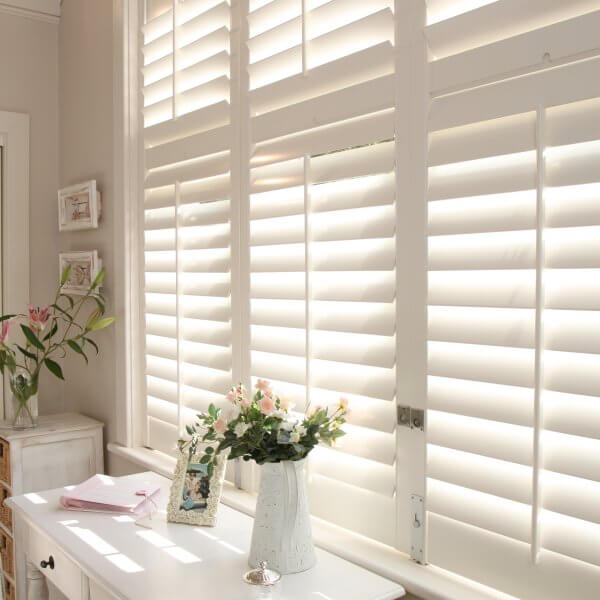 dressing table with window behind and blinds